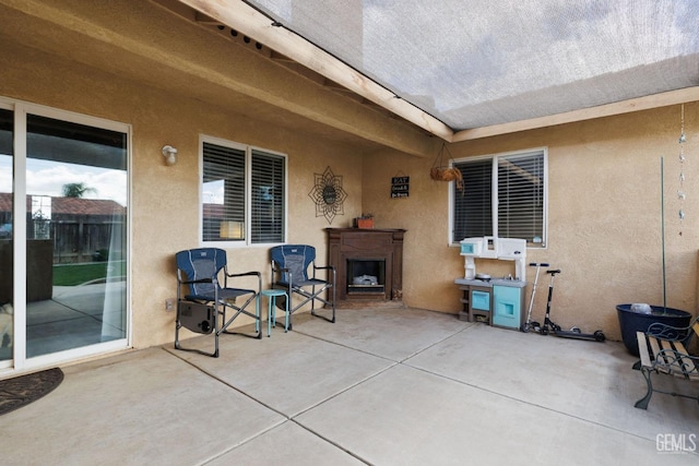 view of patio / terrace featuring an outdoor fireplace