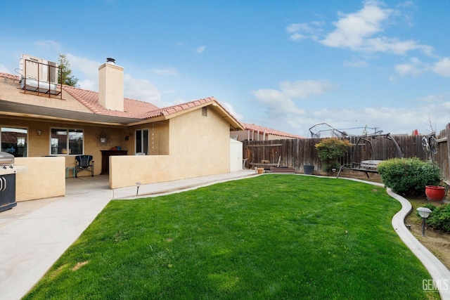 view of yard featuring a patio area and a fenced backyard