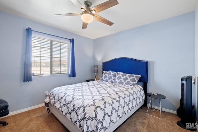 carpeted bedroom with a ceiling fan and baseboards