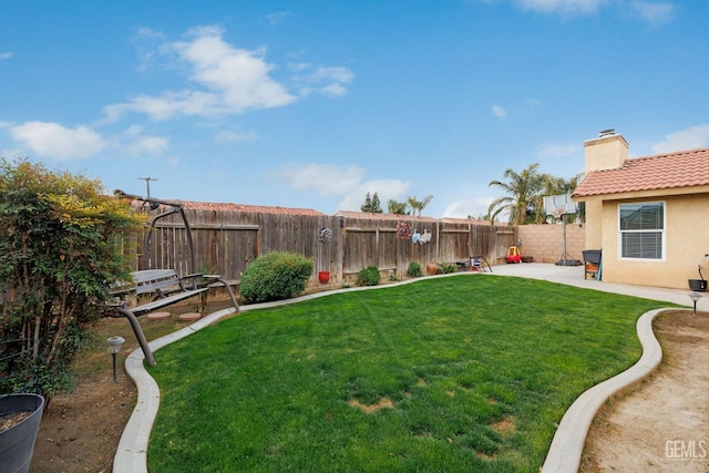 view of yard featuring a patio area and a fenced backyard