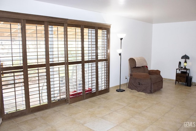 living area with tile patterned flooring