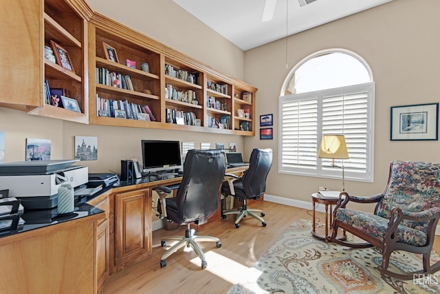 office area featuring light wood-type flooring, baseboards, and a ceiling fan