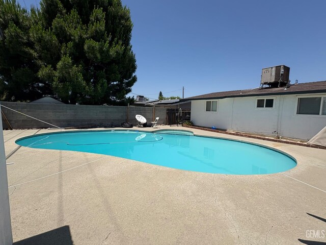 2801 Kaibab Ave, Bakersfield, CA 93306 - view of pool featuring a fenced backyard, a patio, and central AC