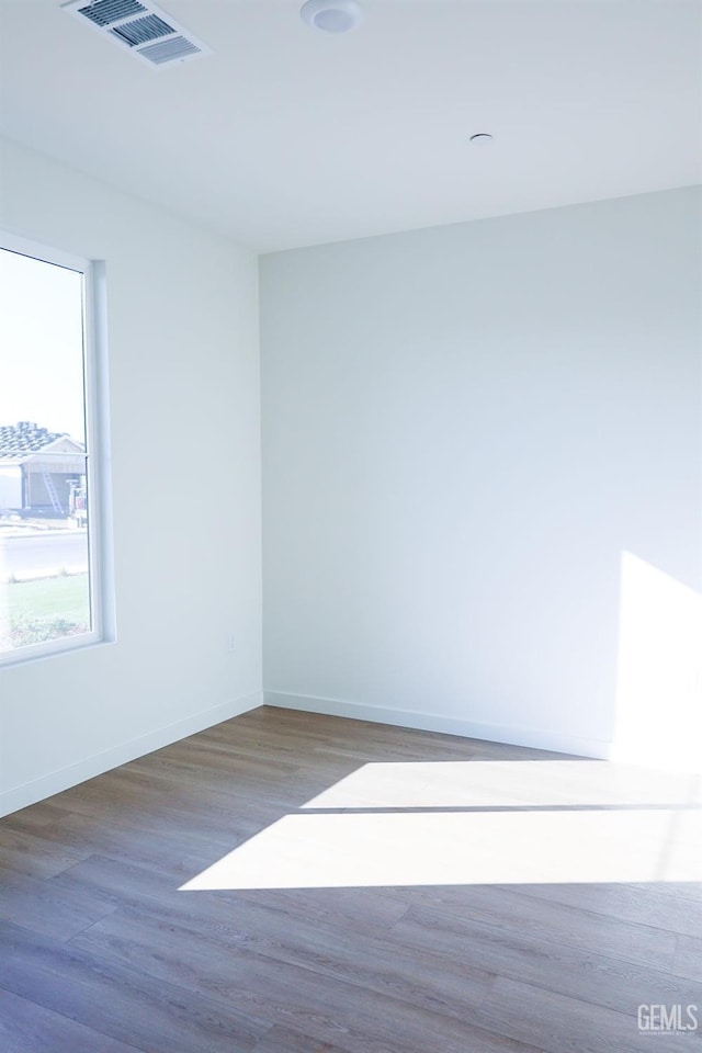 empty room with wood-type flooring