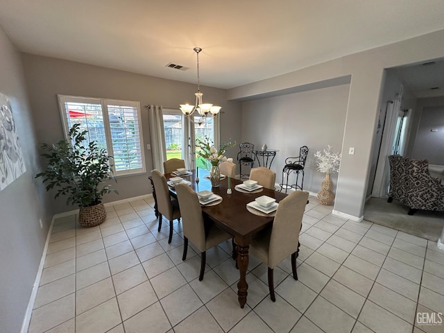 2114 Via Lazio Ave, Delano, CA 93215 - dining area with light tile patterned floors, a chandelier, and baseboards
