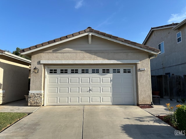 2114 Via Lazio Ave, Delano, CA 93215 - garage with concrete driveway