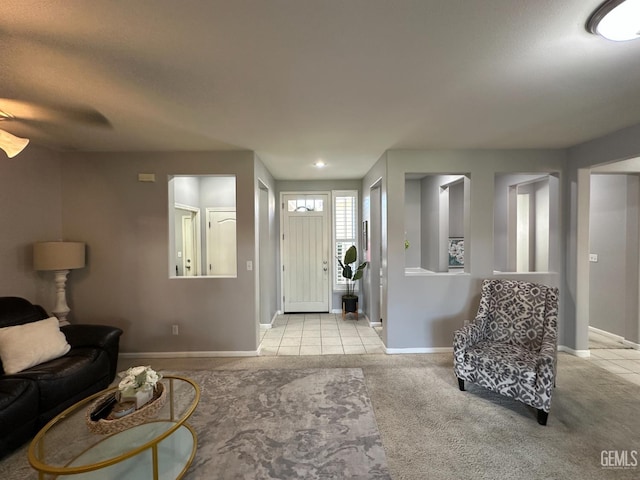 2114 Via Lazio Ave, Delano, CA 93215 - living room featuring baseboards, carpet flooring, and tile patterned floors
