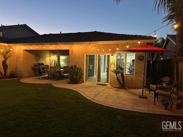 2114 Via Lazio Ave, Delano, CA 93215 - back of property with a patio area and stucco siding