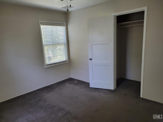 2915 Cedar St, Bakersfield, CA 93301 - unfurnished bedroom featuring dark carpet and a closet