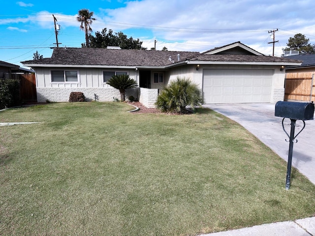 ranch-style home with a garage and a front yard