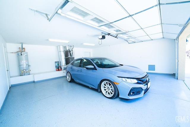 garage with strapped water heater and a garage door opener