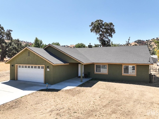 single story home featuring a garage