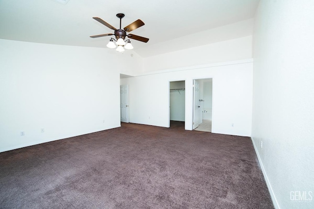 unfurnished bedroom with ceiling fan, dark carpet, and a closet