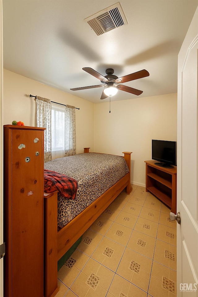 701 Burnett Dr, Bakersfield, CA 93307 - bedroom featuring light tile patterned floors and ceiling fan