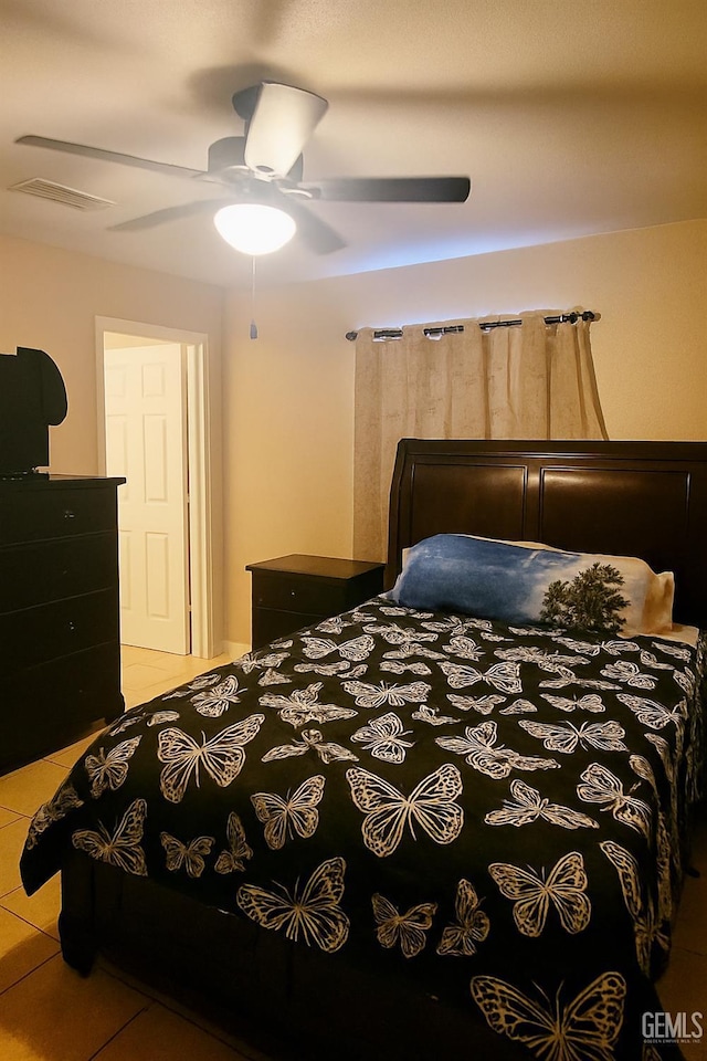 701 Burnett Dr, Bakersfield, CA 93307 - bedroom featuring light tile patterned floors and a ceiling fan