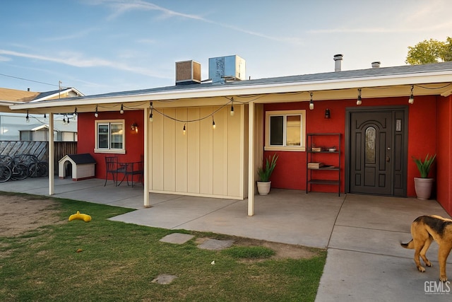 701 Burnett Dr, Bakersfield, CA 93307 - rear view of property featuring a patio area and central AC unit