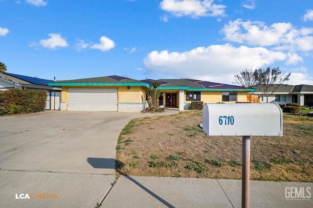 ranch-style house featuring a garage