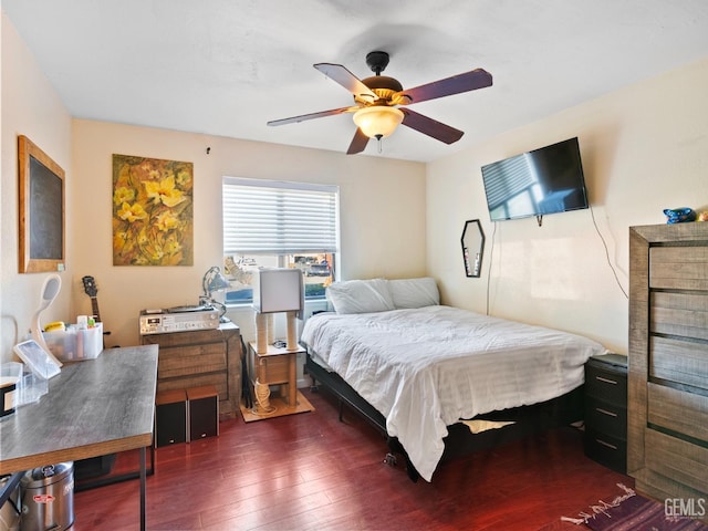 bedroom featuring ceiling fan and dark hardwood / wood-style flooring