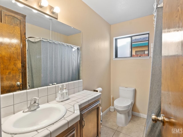 bathroom featuring toilet, a shower with curtain, backsplash, tile patterned floors, and vanity