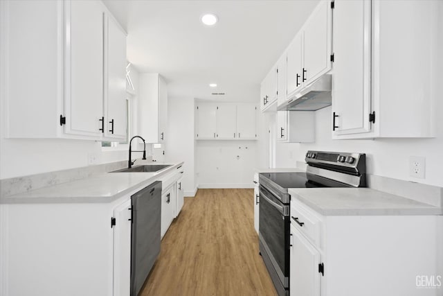 kitchen featuring appliances with stainless steel finishes, light countertops, white cabinetry, and under cabinet range hood