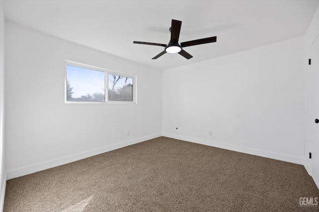 empty room with ceiling fan, baseboards, and carpet flooring