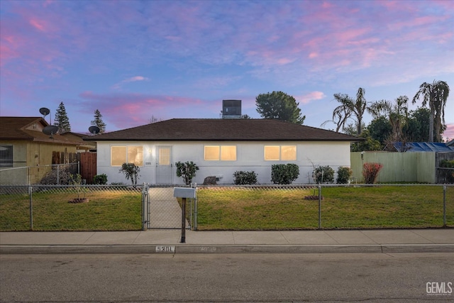 single story home with a fenced front yard, central AC, a yard, a gate, and stucco siding