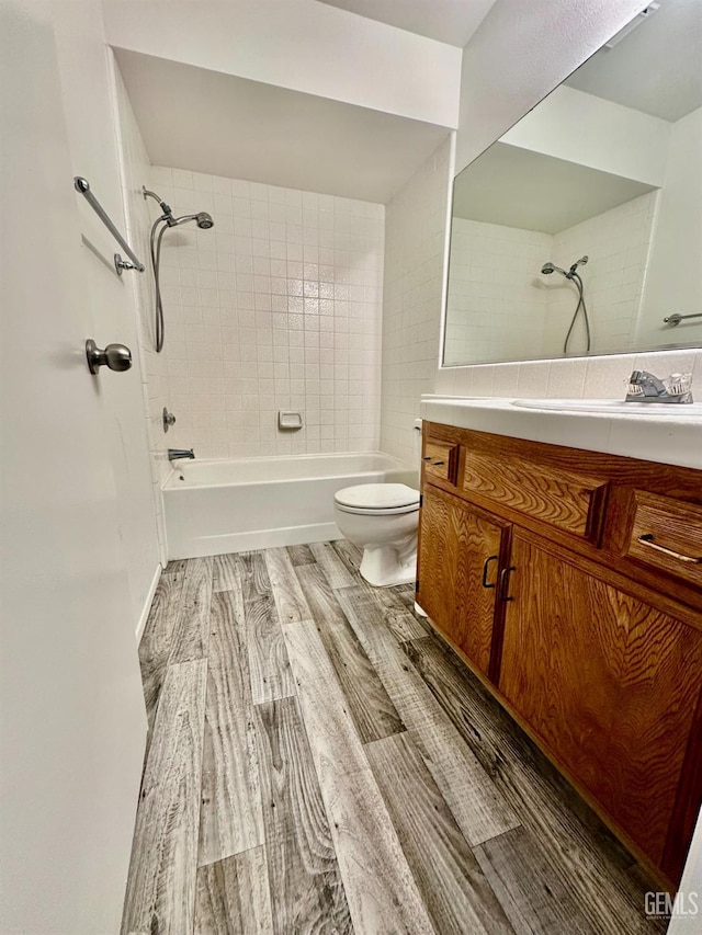 5821 Willowcrest St, Bakersfield, CA 93313 - full bath featuring vanity, shower / washtub combination, and wood finished floors