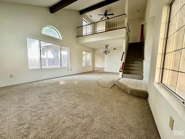 5821 Willowcrest St, Bakersfield, CA 93313 - unfurnished living room with carpet flooring, ceiling fan, beamed ceiling, stairs, and high vaulted ceiling