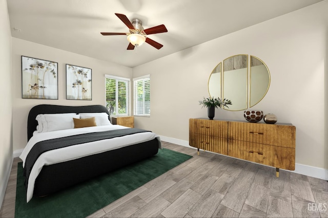 1701 Elm St, Bakersfield, CA 93301 - bedroom with wood finished floors, baseboards, and a ceiling fan