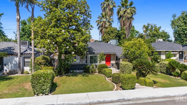1701 Elm St, Bakersfield, CA 93301 - view of property hidden behind natural elements featuring a front yard