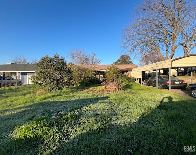 view of front of property with a carport and a front yard