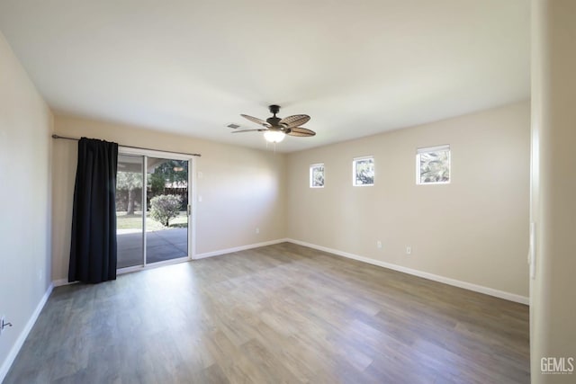 unfurnished room with wood-type flooring and ceiling fan