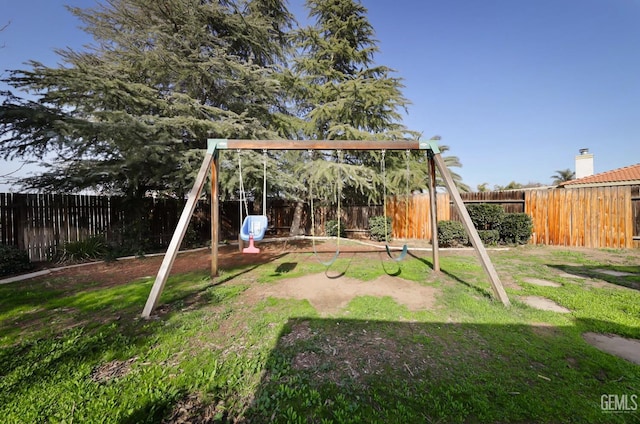 view of playground with a yard