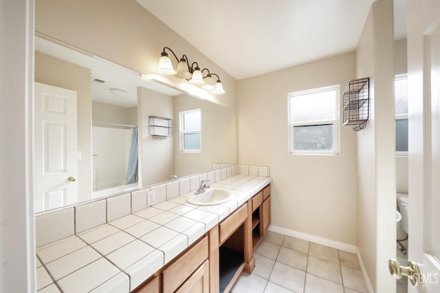 bathroom with a shower with shower curtain, vanity, toilet, and tile patterned flooring