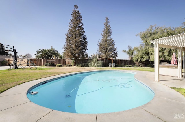 view of pool with a yard and a pergola