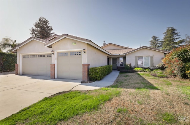 ranch-style house featuring a garage and a front lawn