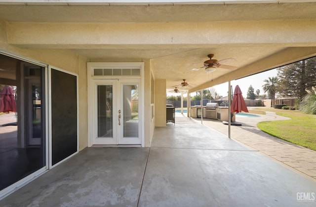 view of patio / terrace with area for grilling, a fenced in pool, french doors, and ceiling fan