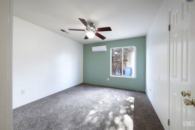 carpeted spare room featuring ceiling fan and a wall unit AC