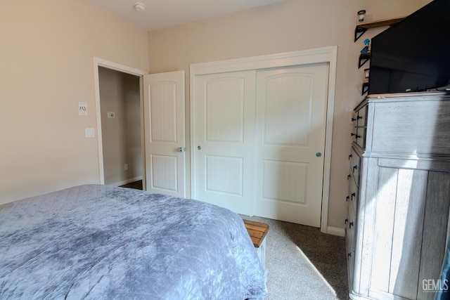 carpeted bedroom featuring a closet