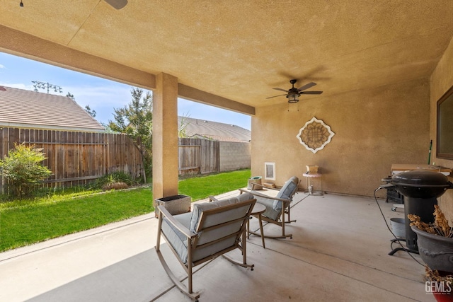 3606 Azure Dr, Bakersfield, CA 93312 - fenced backyard with ceiling fan, a patio, and grilling area