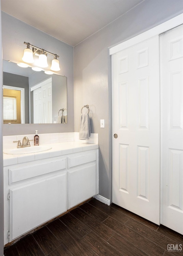 bathroom featuring vanity and hardwood / wood-style floors