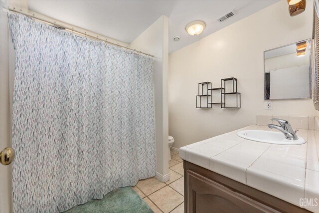 5702 San Pierre Ct, Bakersfield, CA 93308 - bathroom featuring vanity, tile patterned floors, and curtained shower