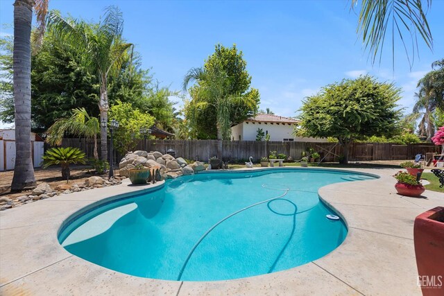 5702 San Pierre Ct, Bakersfield, CA 93308 - view of swimming pool with a fenced backyard and a patio area