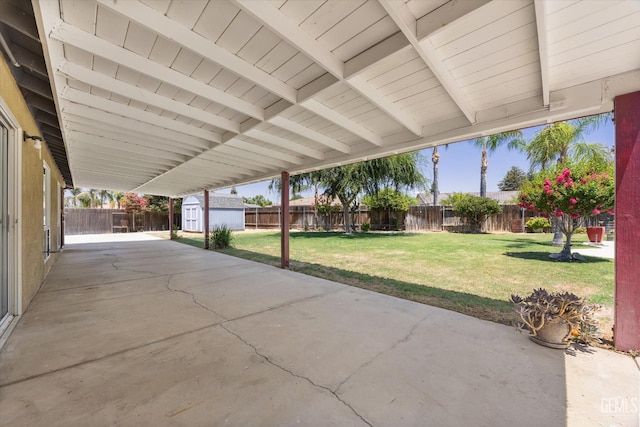 5702 San Pierre Ct, Bakersfield, CA 93308 - fenced backyard with a storage unit and a patio area