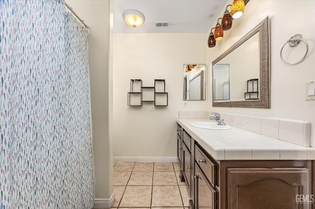 5702 San Pierre Ct, Bakersfield, CA 93308 - full bathroom with vanity, tile patterned flooring, and curtained shower