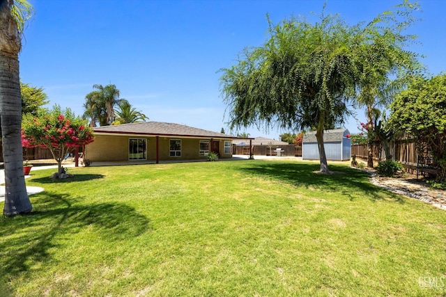 5702 San Pierre Ct, Bakersfield, CA 93308 - fenced backyard with a storage unit