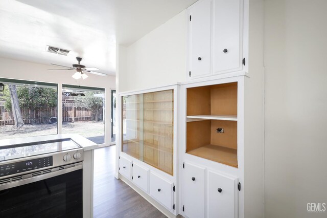 1312 Shattuck Ave, Bakersfield, CA 93305 - kitchen featuring electric range, a ceiling fan, white cabinets, and wood finished floors