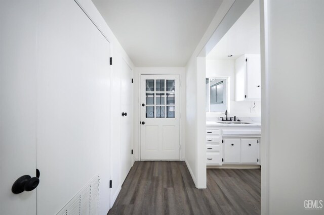 1312 Shattuck Ave, Bakersfield, CA 93305 - hallway with a sink and dark wood finished floors
