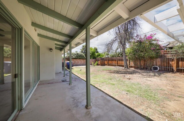 1312 Shattuck Ave, Bakersfield, CA 93305 - fenced backyard with a patio