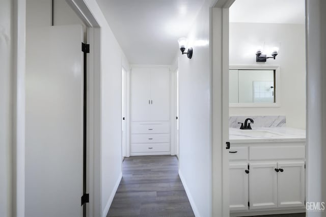 1312 Shattuck Ave, Bakersfield, CA 93305 - hall featuring dark wood-style flooring and a sink